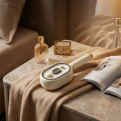 Electric spray massage comb on marble nightstand