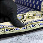 Hand pressing into the thick memory foam padding
