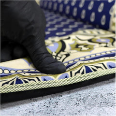 Hand pressing into the thick memory foam padding